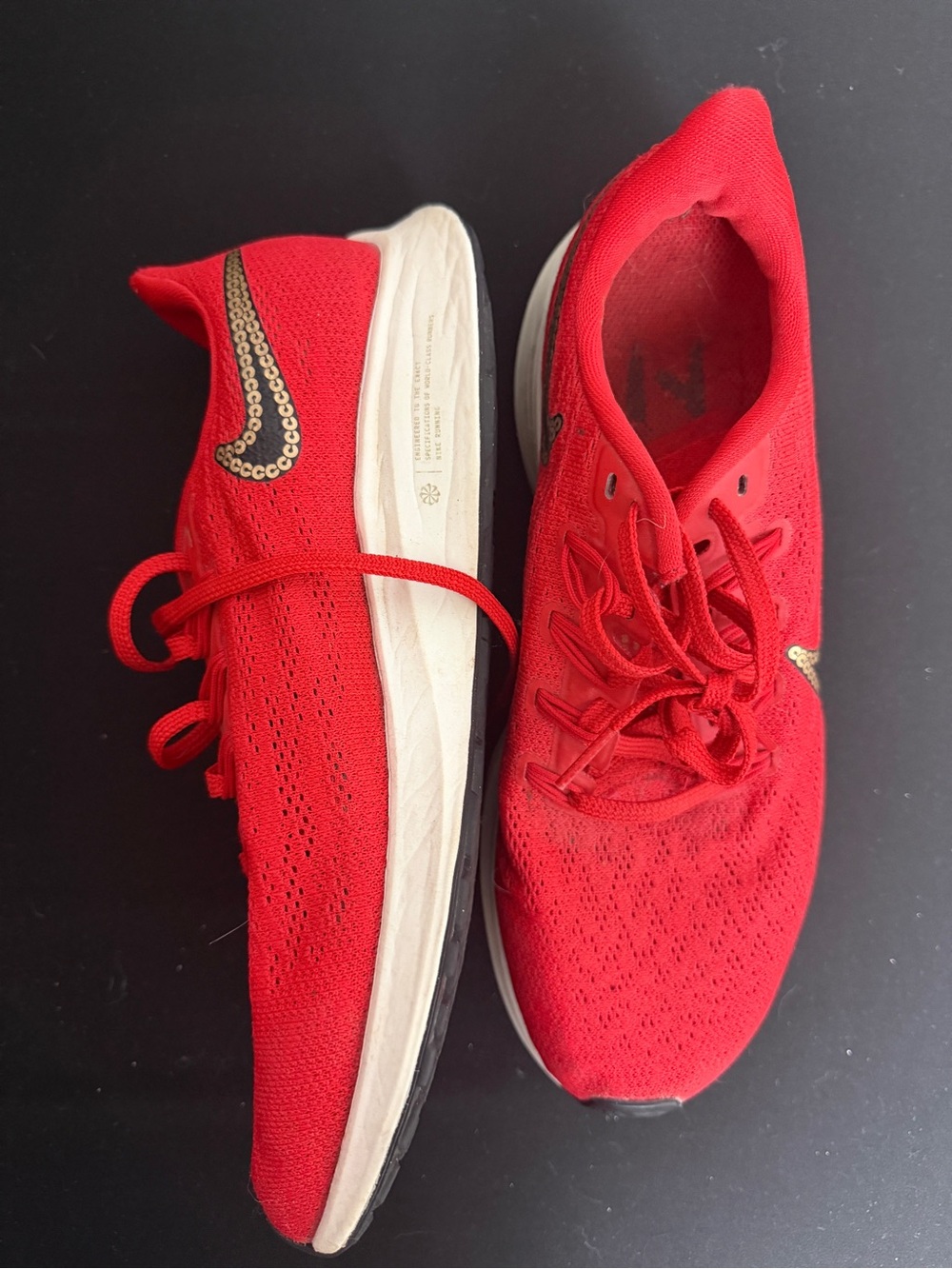 Nike Women's Red Running Shoes with Gold Swoosh Detail